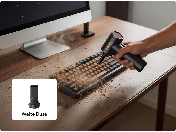 Das Bild demonstriert die Nutzung der **Weiten Düse**. Mit dieser Düse blasen Sie Krümel, Staub und Schmutz aus Ihrer mechanischen Tastatur. Die breite Luftströmung eignet sich hervorragend für die Reinigung großer Flächen und Tastaturzwischenräume.